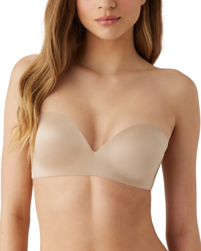 Model wearing a molded wire-free strapless bra in beige