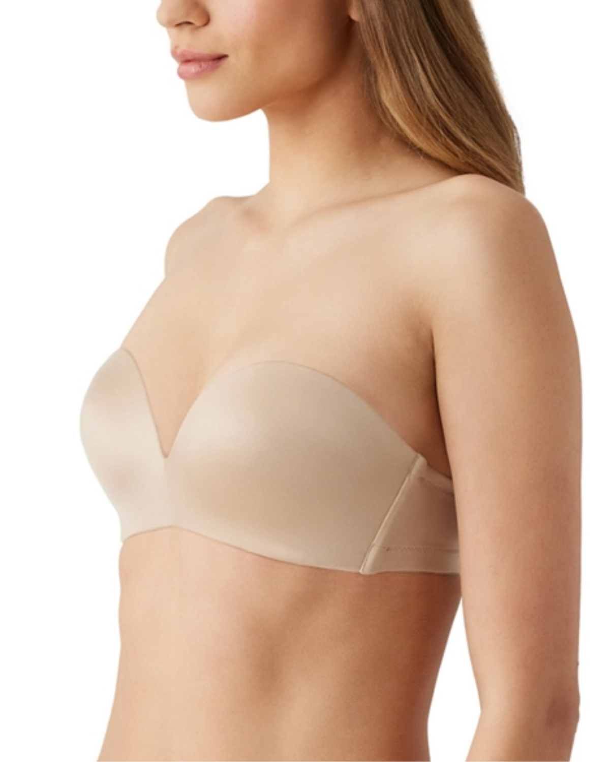 Model wearing a molded wire-free strapless bra in black with detachable straps to wear multiple ways in beige