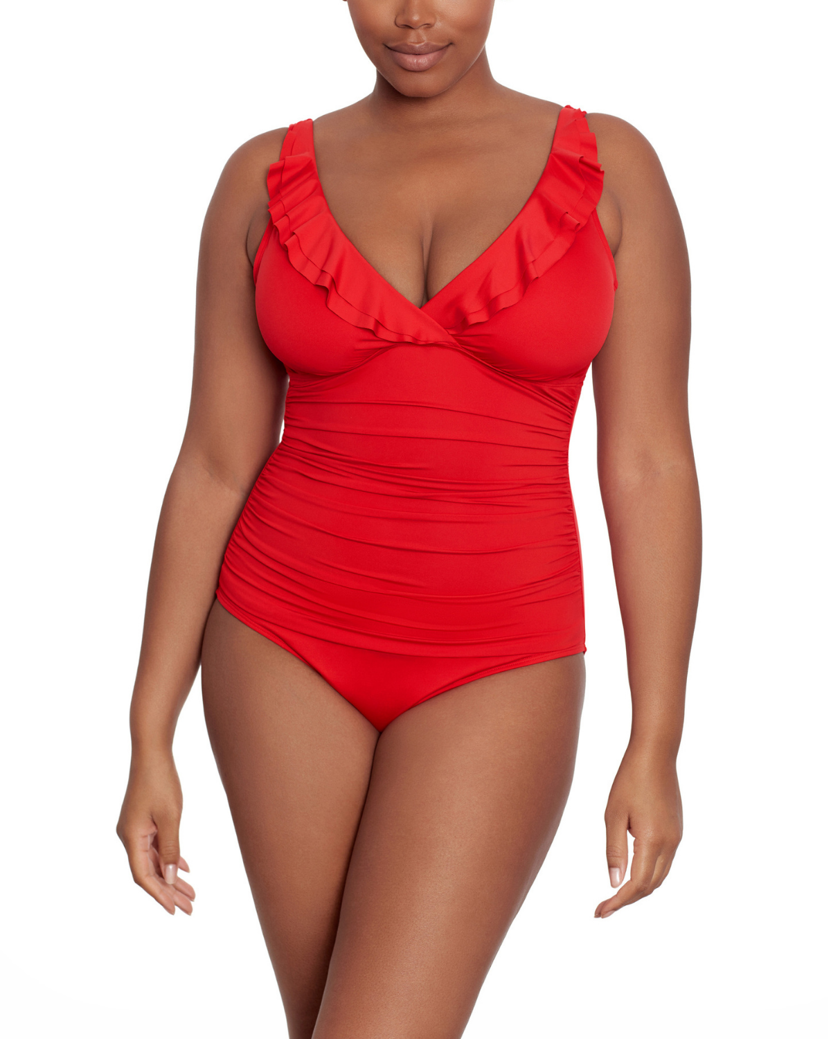 Model wearing a v-neck one piece with a ruffle trim and shirred panel around the torso in red