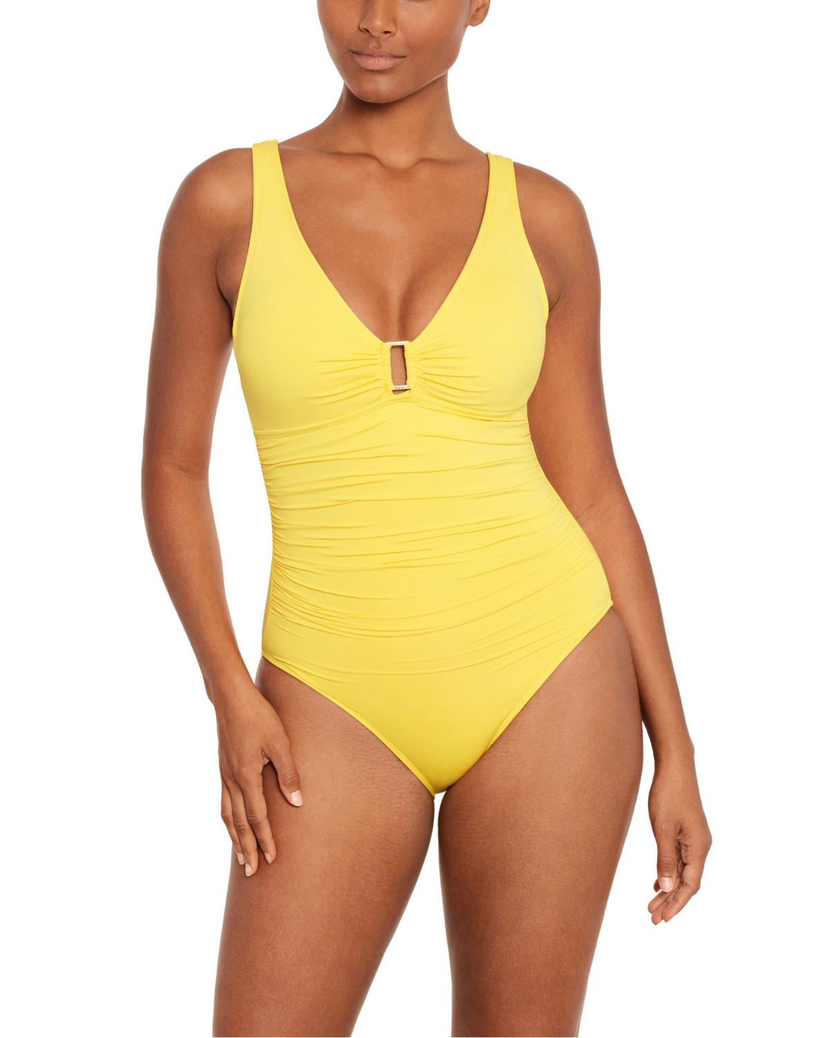 Model wearing a v-neck one piece with a ring detail and shirred torso in yellow
