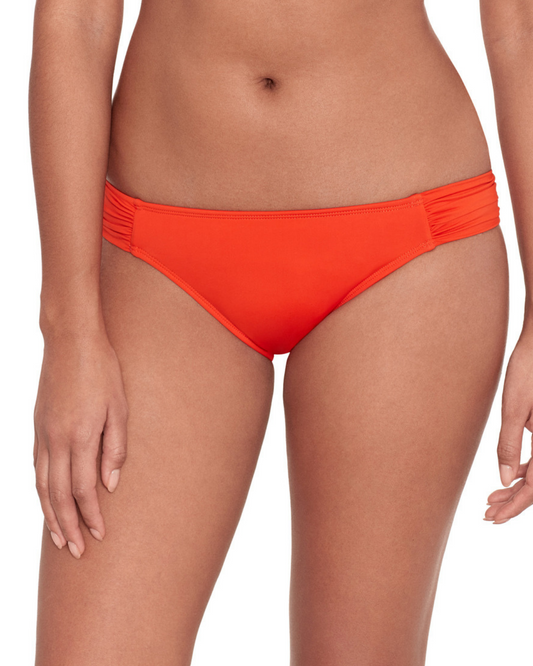 Model wearing a tab side hipster bikini bottom in orange