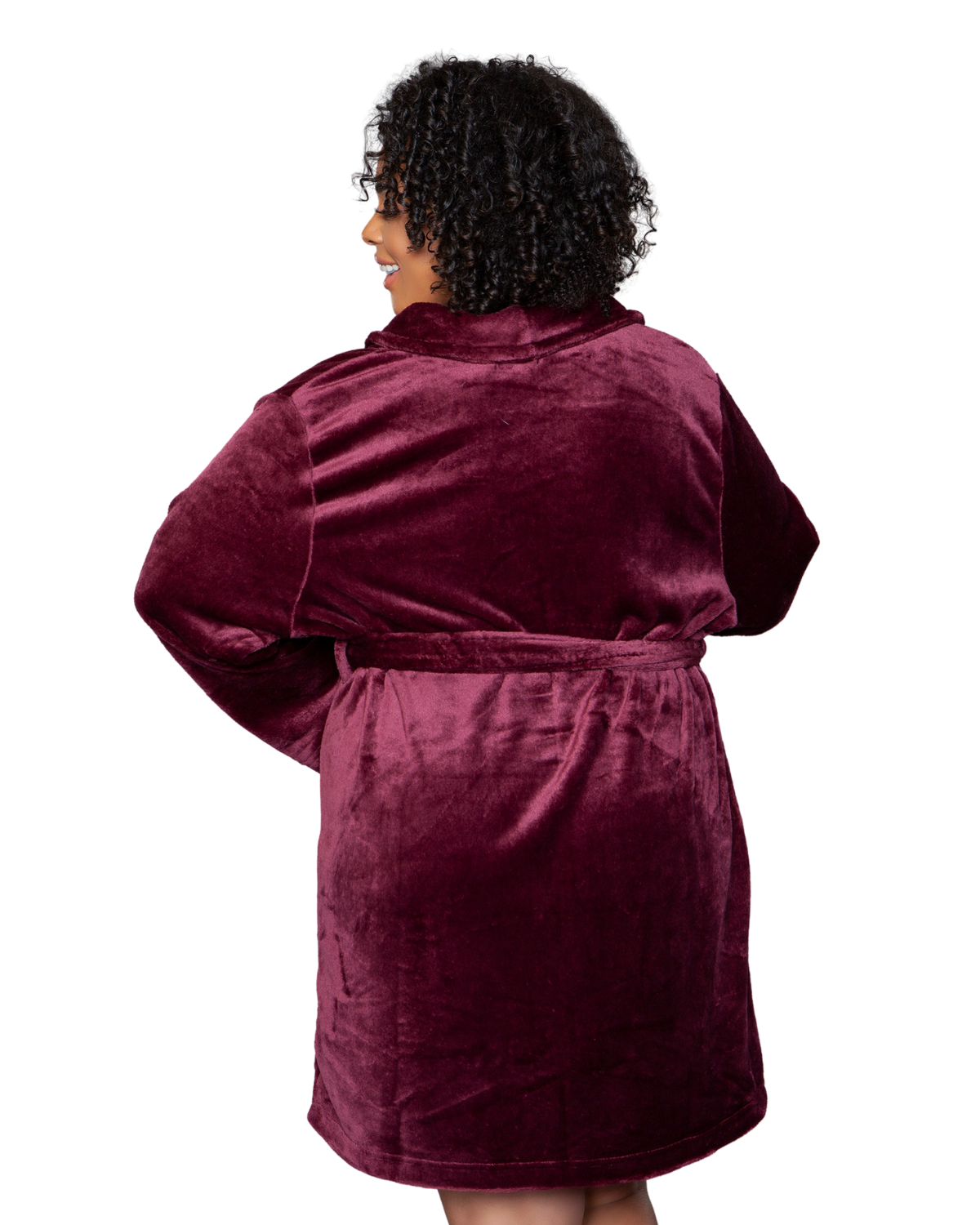 Model wearing a knee length plush robe in maroon