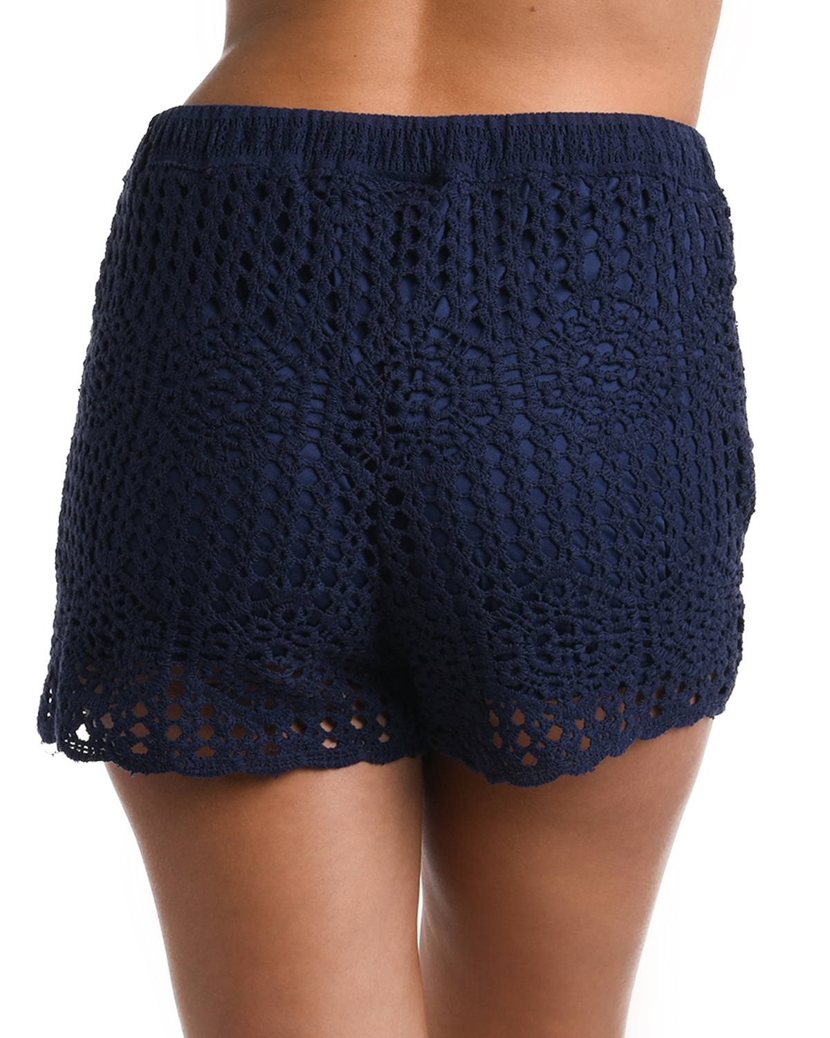 Model wearing a crochet short in indigo