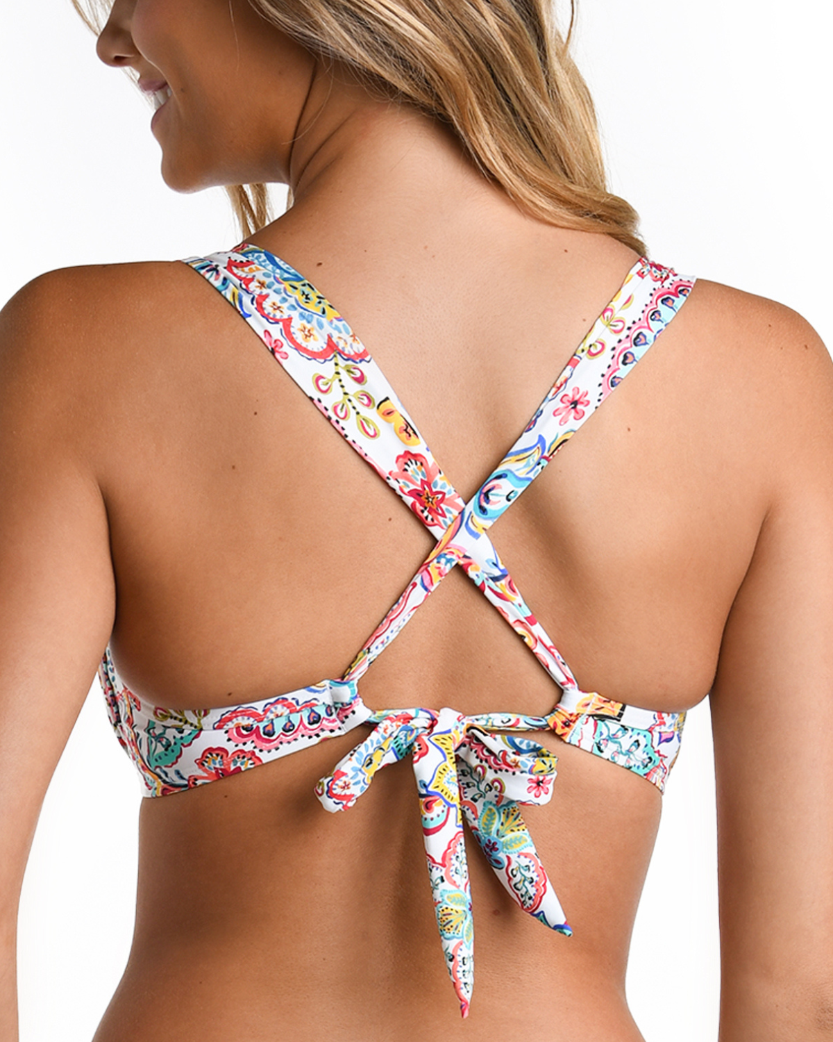 Model wearing an underwire bikini top in a white multicolored gypsy floral print