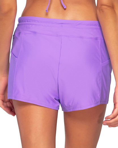 Model wearing a swim short with side pocket in lavender