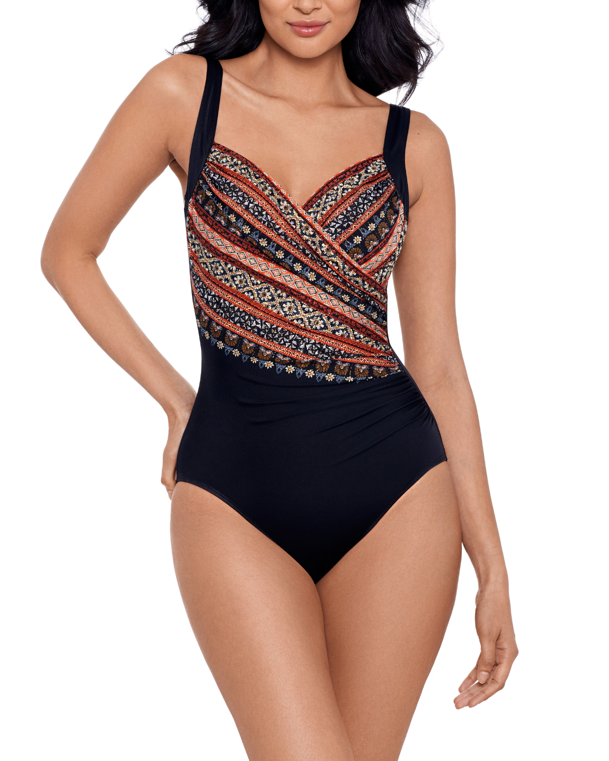 Model wearing a one piece swimsuit with hidden underwire in a black and tribal print