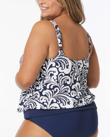 Model wearing a blouson tankini top in a navy and white scroll print