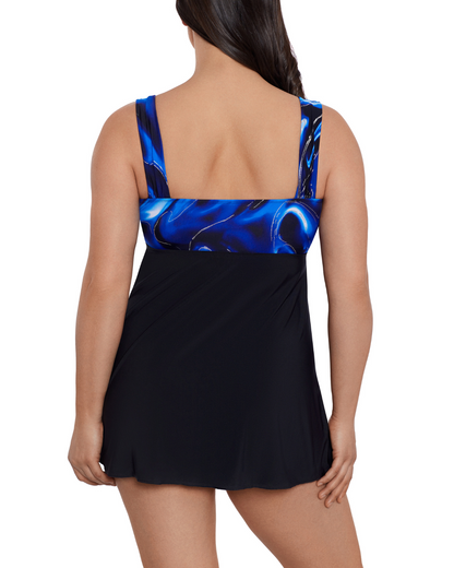 Model wearing a tie front swim dress in black with a black and blue marble print top