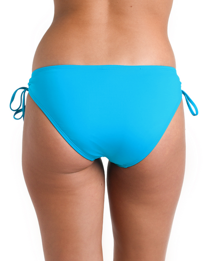 Model wearing a tie side hipster bikini bottom in turquoise