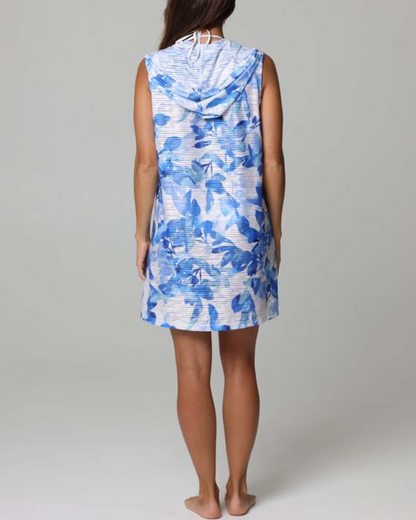 Model wearing a zip up sleeveless hoodie dress cover up in blue and white floral print