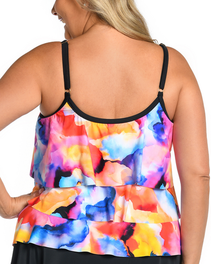 Plus size model wearing a triple tiered tankini top in a multi colored watercolor style print
