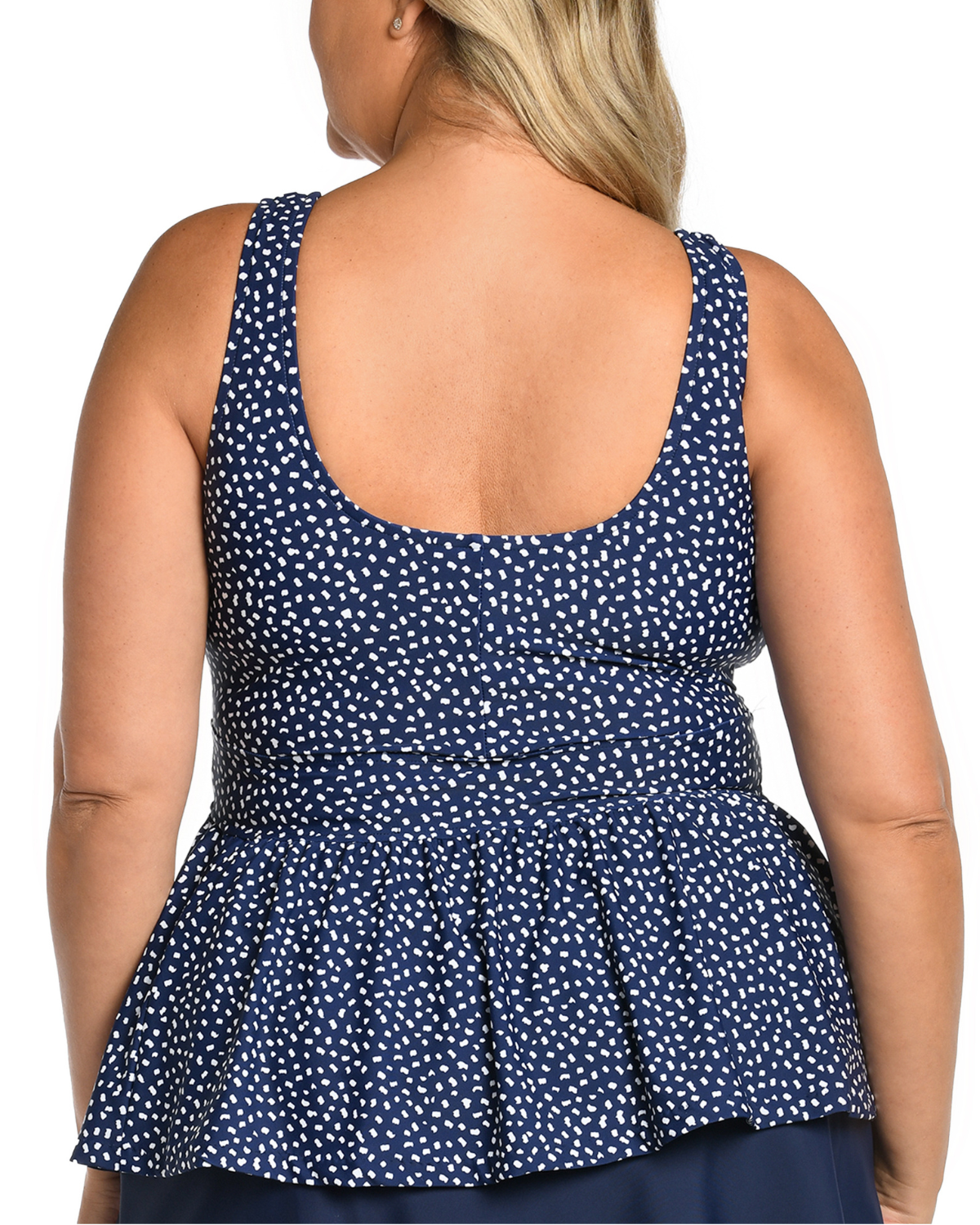 Plus size model wearing a tankini top with a v-neck in a navy and white dot print
