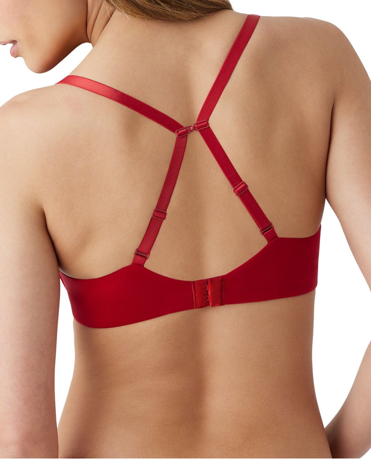 Back view of model on a white backdrop wearing a red wire-free t-shirt bra with fully adjustable straps. The straps are converted to a racerback with a j-hook.