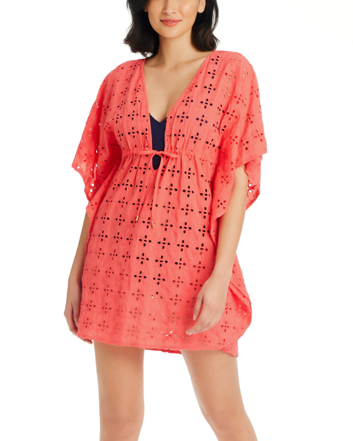 Model wearing a caftan cover up in coral