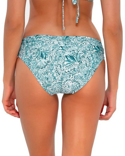 Model wearing a hipster brief bottom in a pale turquoise, white and navy paisley print