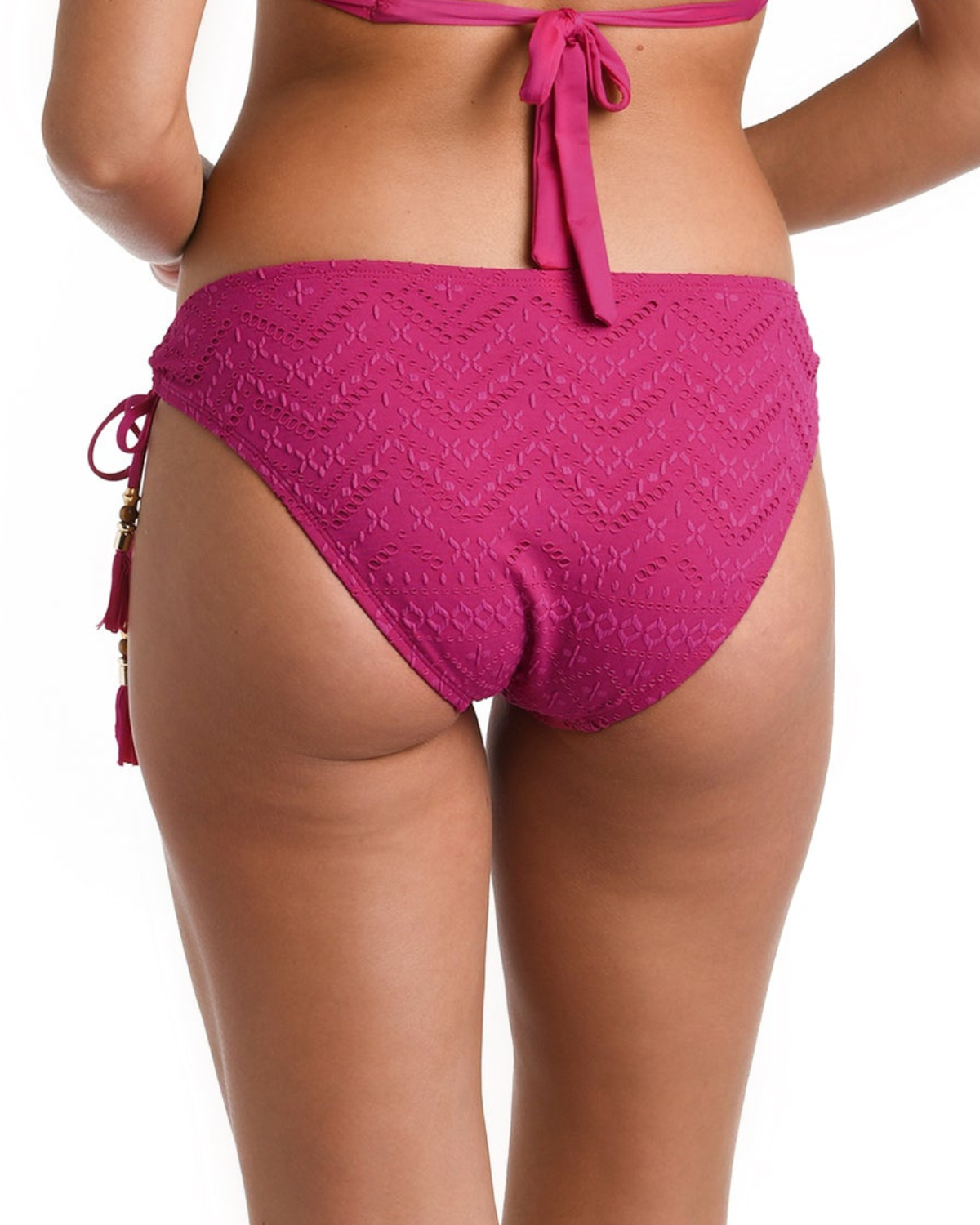Model wearing a tie side bikini bottom in pink