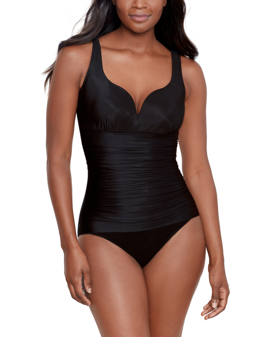 Model wearing a one piece with hidden v wire and shirred torso in black