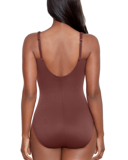 Model wearing a one piece swimsuit with a sweetheart neckline and hidden underwire in brown