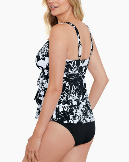 Model wearing a triple tier tankini in a floral black and white print