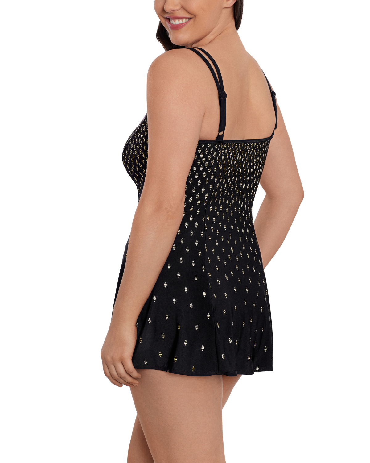 Model wearing an empire swimdress in black with gold dots 