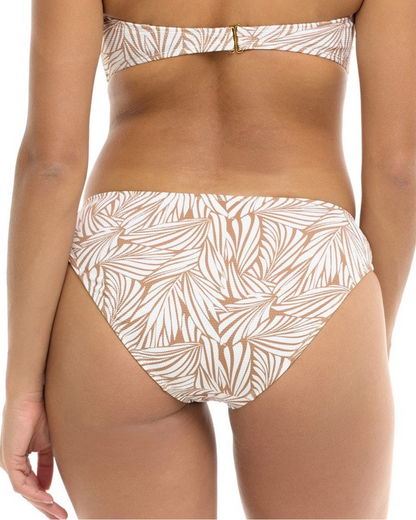 Model wearing a hipster bikini bottom in a white and tan leaf print