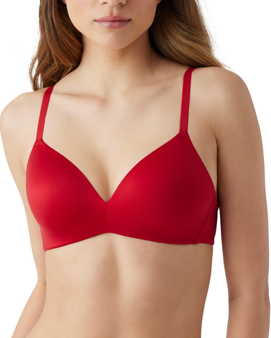Front view of model on a white backdrop wearing a red wire-free t-shirt bra with smooth molded cups.