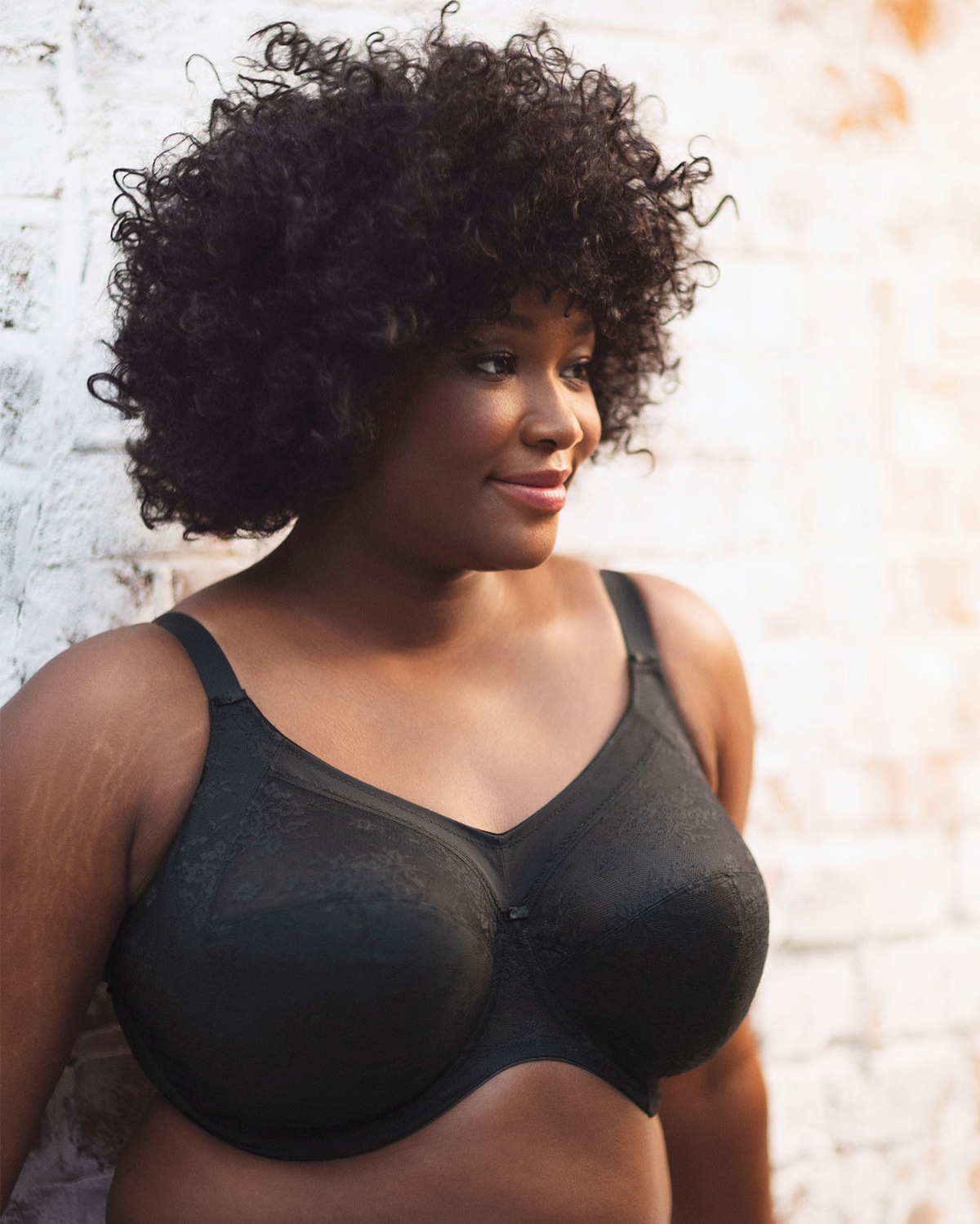 Model wearing a cut and sew full cup banded underwire bra in black