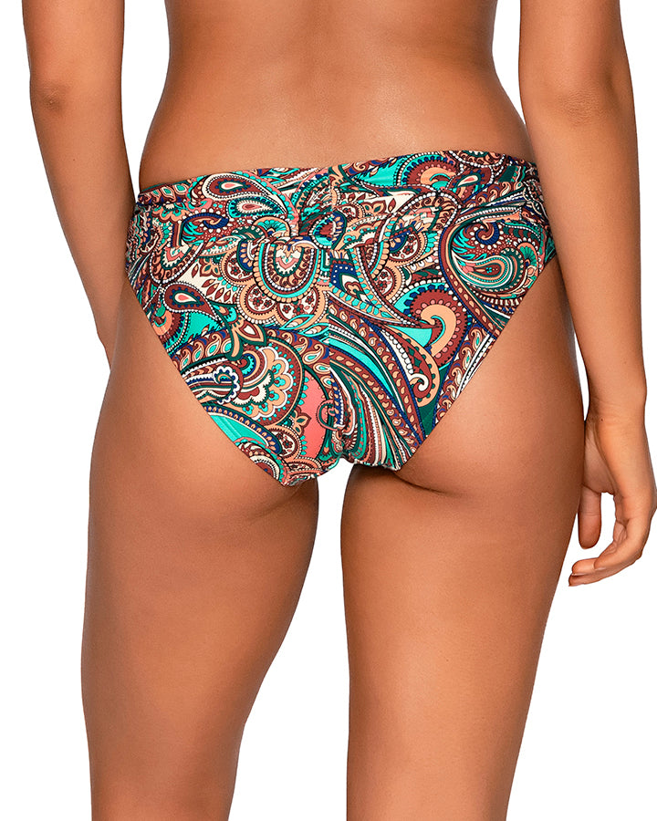 Model wearing a hipster bikini bottom in a brown, turquoise and navy paisley print. 