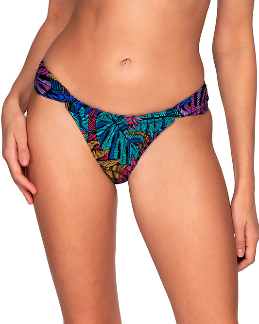 Model wearing a hipster bikini bottom in a pink, purple, blue and yellow palm frond print.