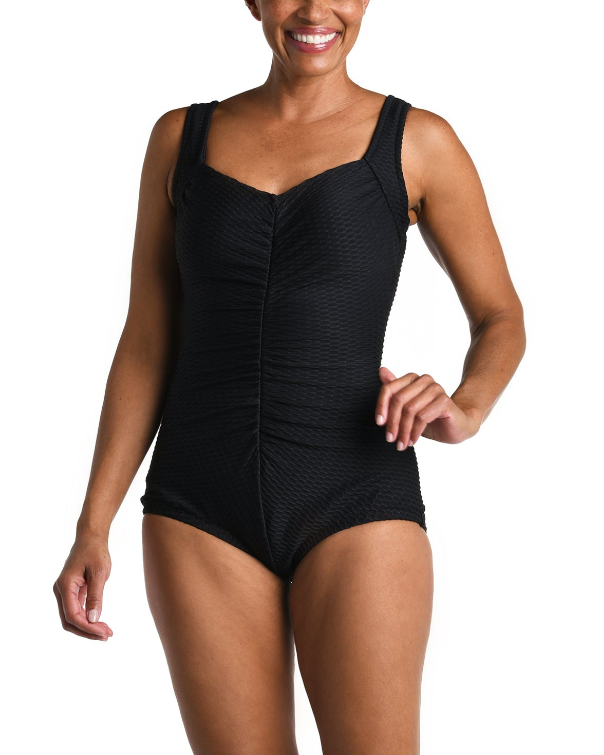 Model wearing a textured one piece swimsuit with a girl leg cut in black