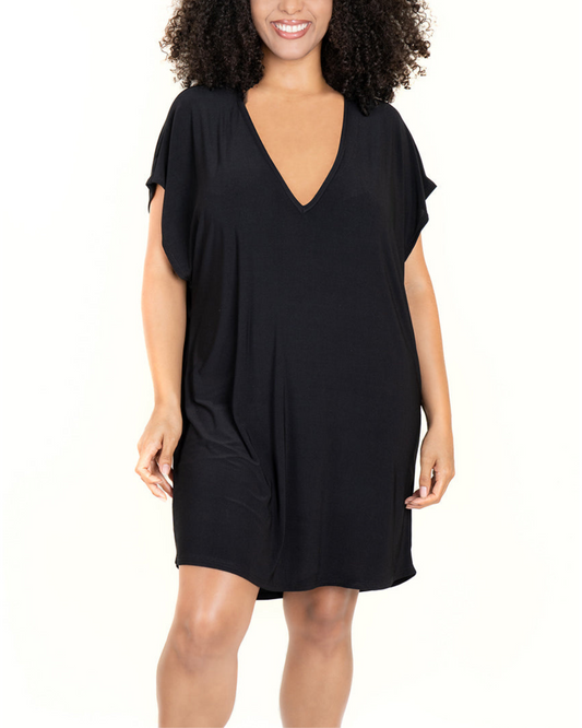 Model wearing a v-neck tunic with back cut out details in black