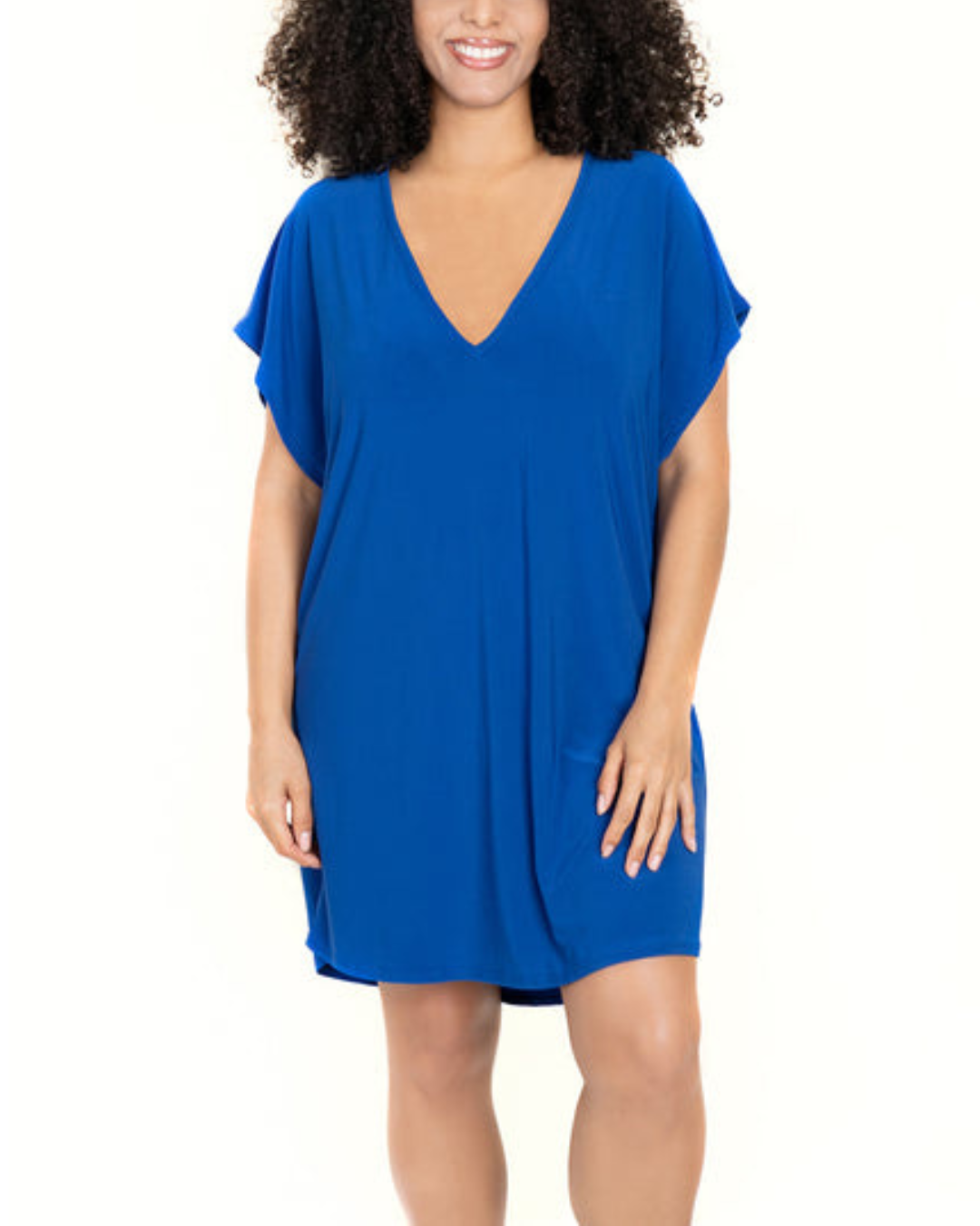 Model wearing a v-neck tunic with back cut out details in royal blue