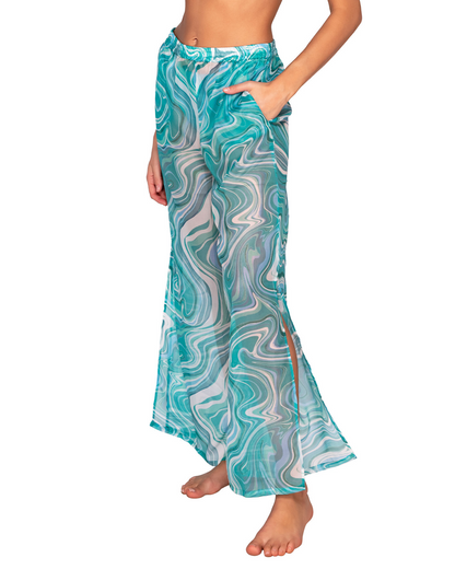 Model wearing a wide leg cover up pant with a side slit in a pale turquoise and white swirl print.