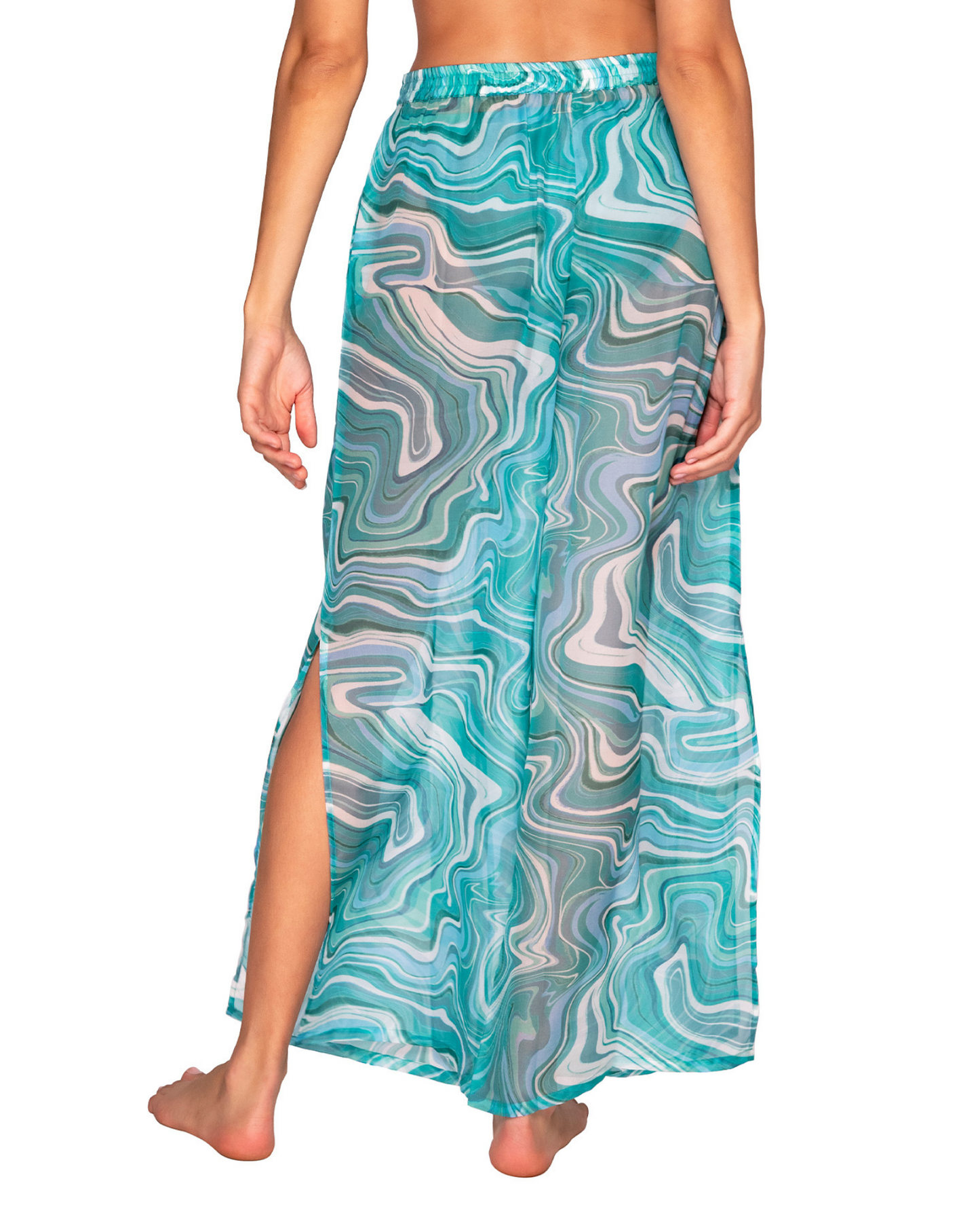 Model wearing a wide leg cover up pant with a side slit in a pale turquoise and white swirl print.