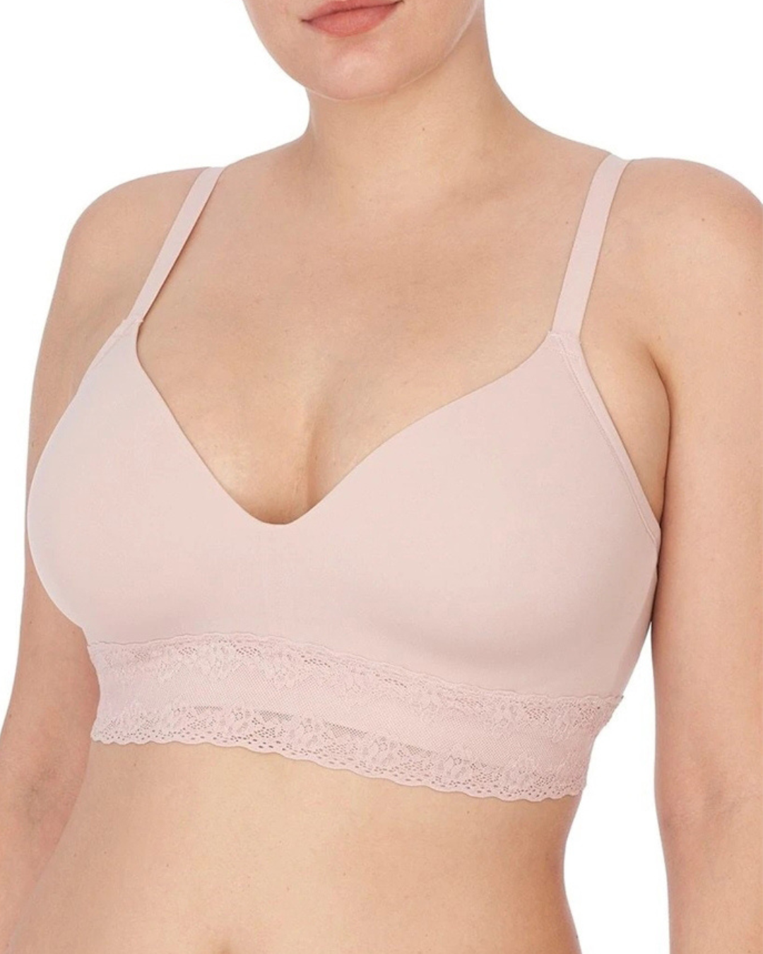 Model wearing a wire free t-shirt bra with a lace band in blush pink