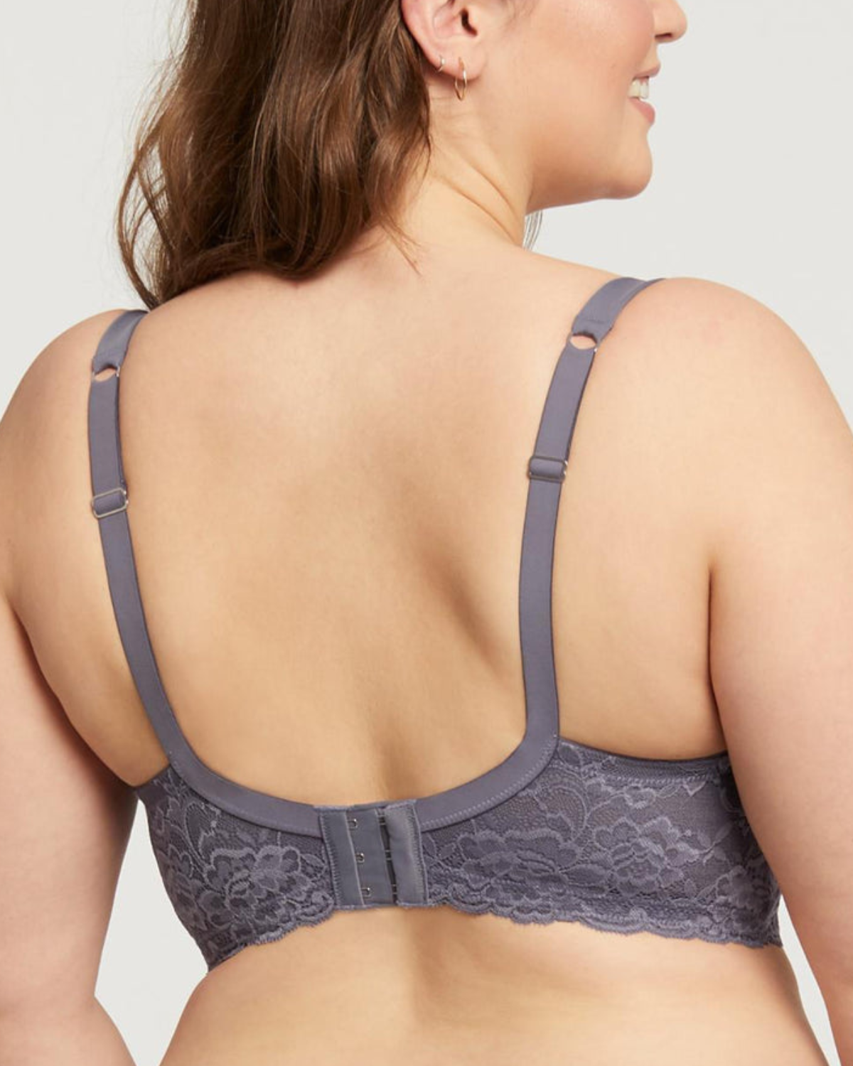 Model wearing a molded t-shirt underwire bra with lace side wings in grey