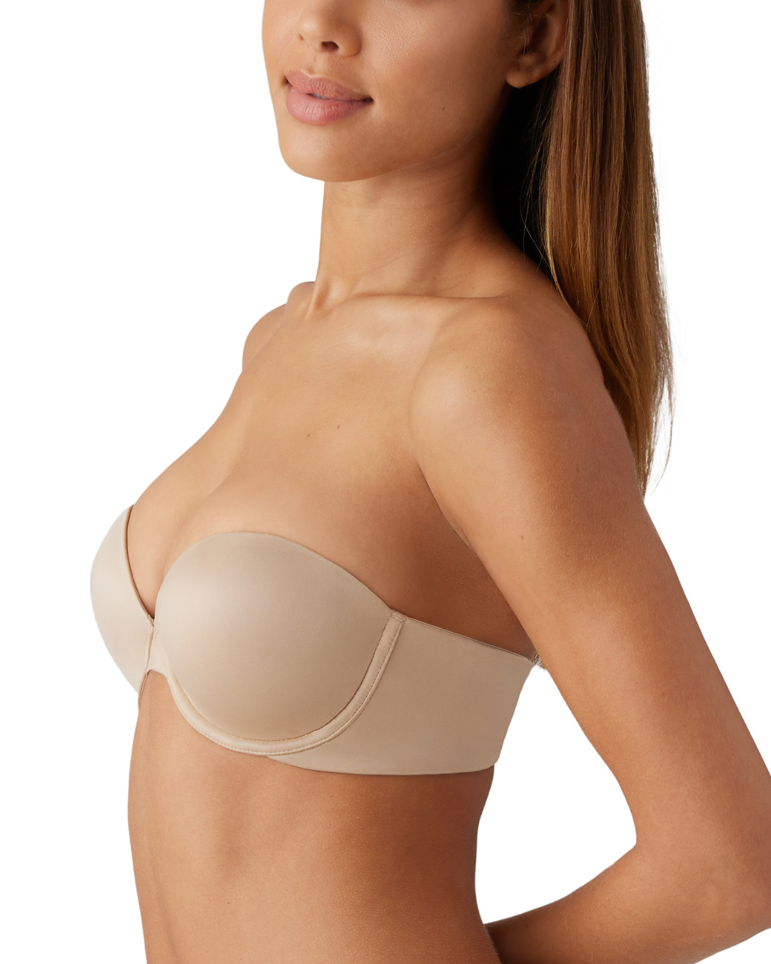 Model wearing a molded strapless underwire bra with hook and eye closure and convertible straps in nude