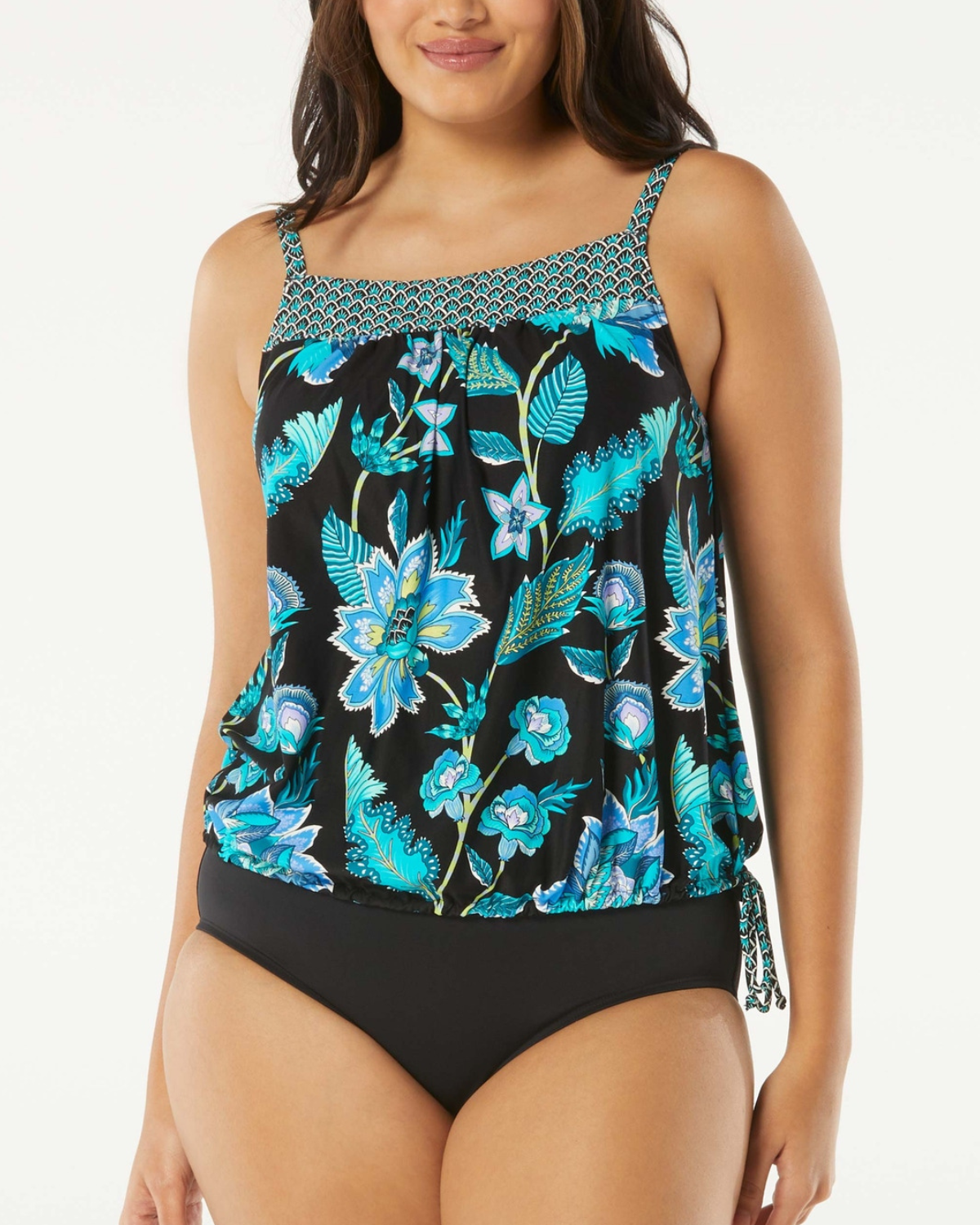 Model wearing a blouson tankini top with a floral print in black, blue and green