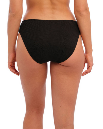 Model wearing a mid rise brief bikini bottom in black
