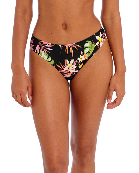 Model wearing a bikini brief with a floral print against a black base