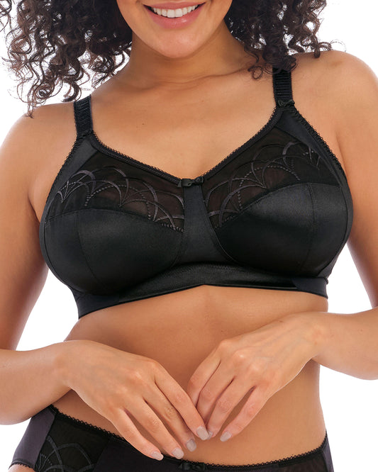Model wearing a soft cup wire free bra in black