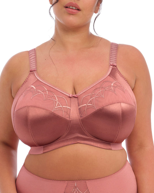 Model wearing soft cup wire free bra in rose pink
