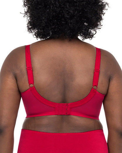 Model wearing a cut and sew underwire banded bra in red