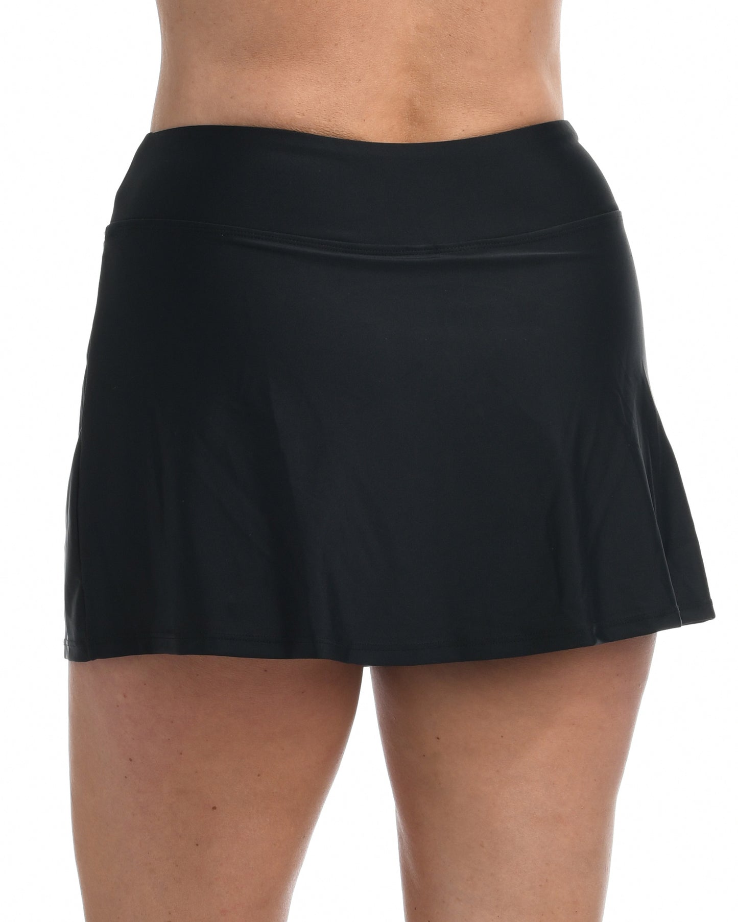 Model wearing a swim skirt with shorts underneath in black 