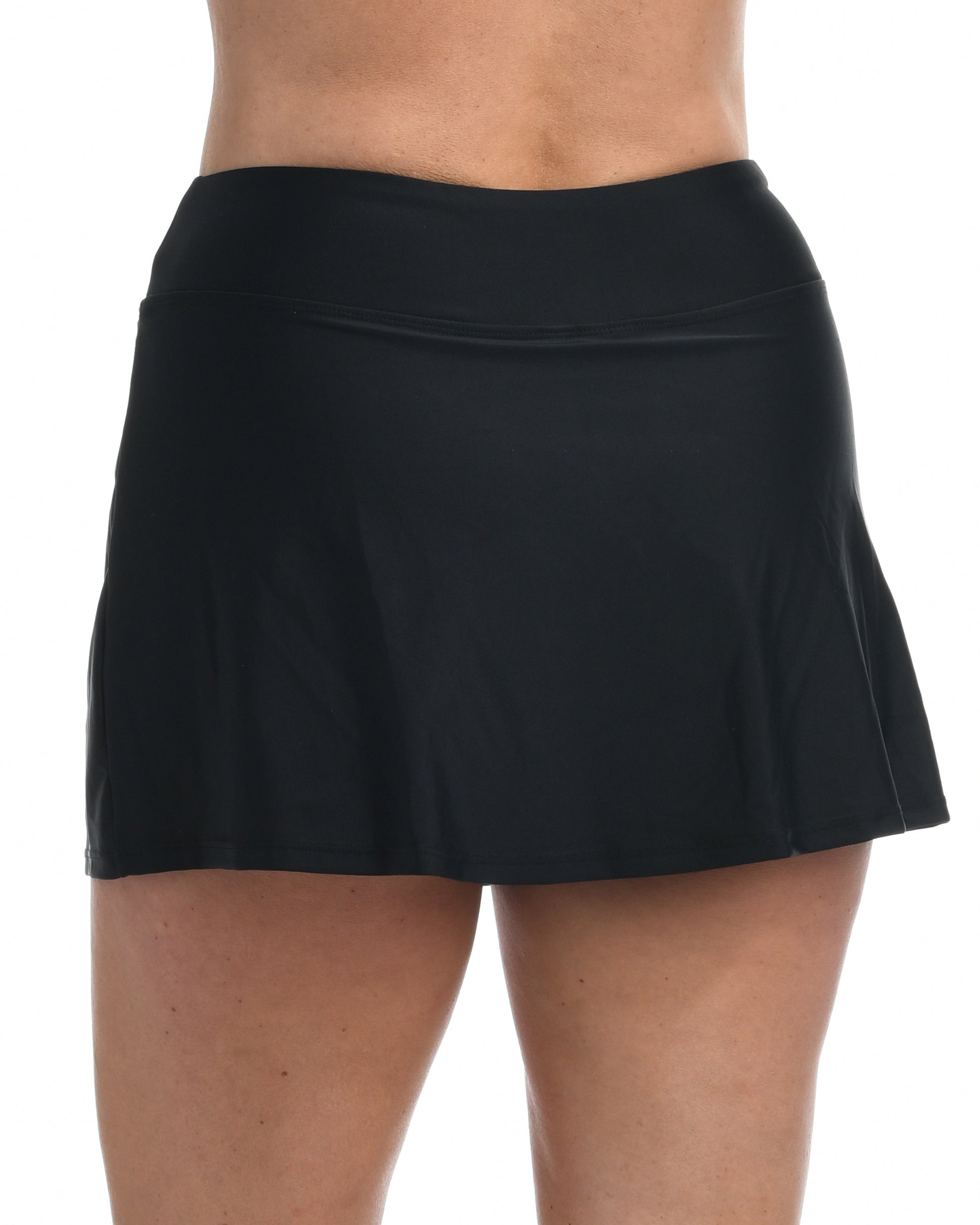 Model wearing a swim skirt with shorts underneath in black 