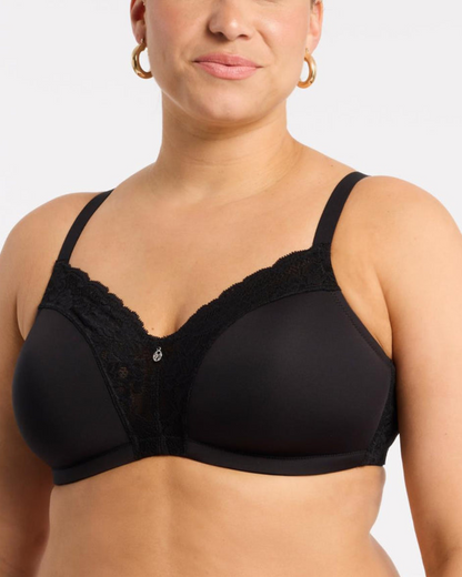 Model wearing a wire free molded cup bra with lace wings in black