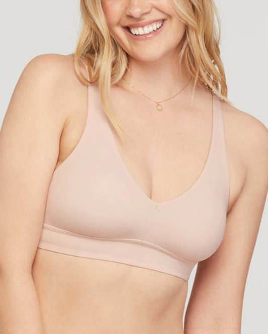 Model wearing a wire free bralette in beige