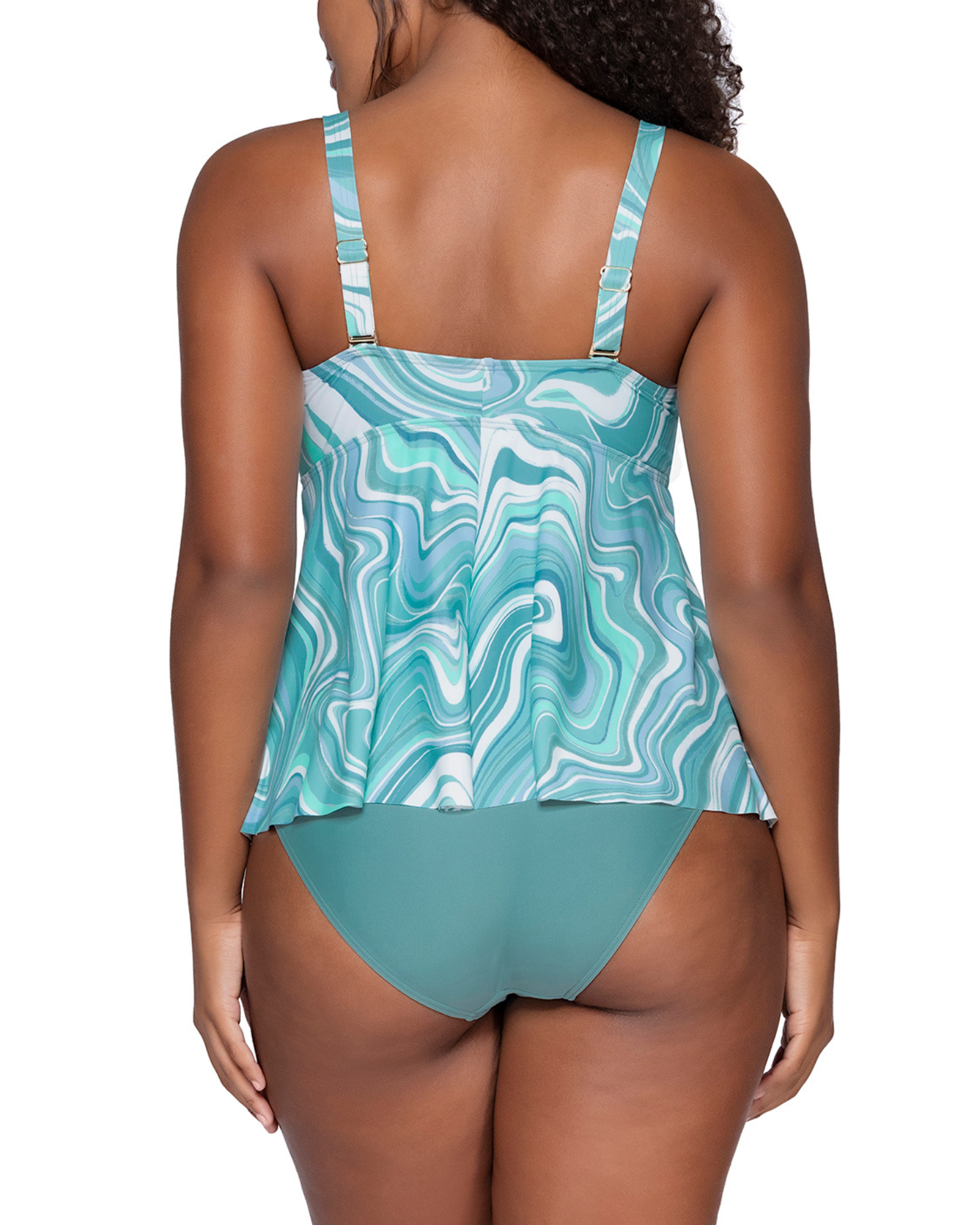 Model wearing a babydoll style tankini with hidden underwire in a pale turquoise and white swirl print 