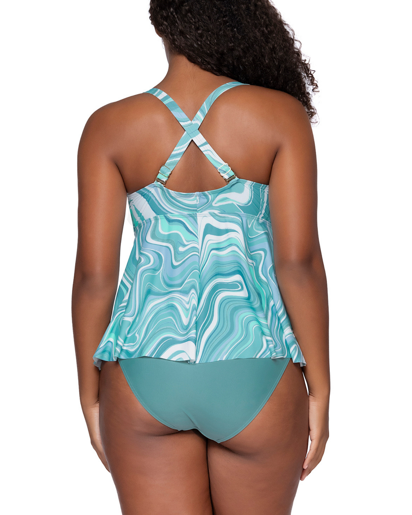 Model wearing a babydoll style tankini with hidden underwire in a pale turquoise and white swirl print 