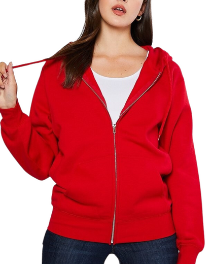 Model on a white backdrop wearing a women's oversized fleece zip up hooded sweater in solid red